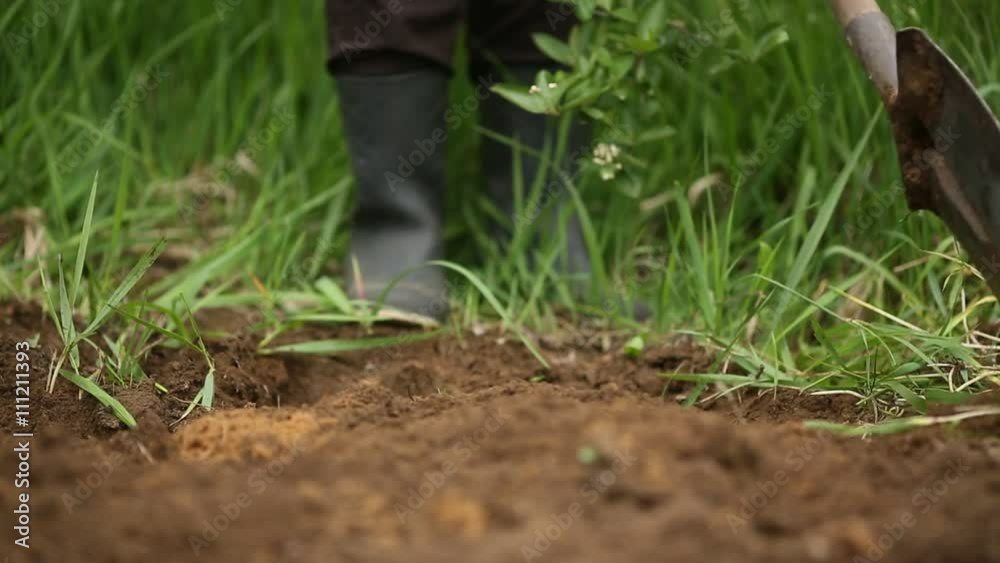 Digging spring soil with shovel. Close-up. Digging spring soil with shovel. Close-up.