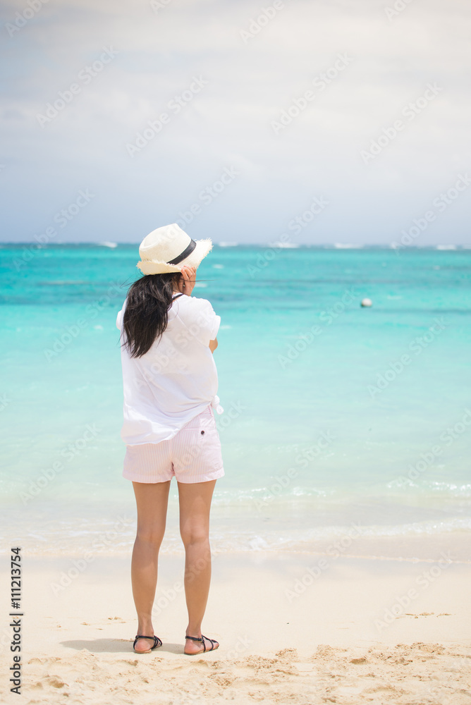 Girl standing on the beach Girl standing on the beach