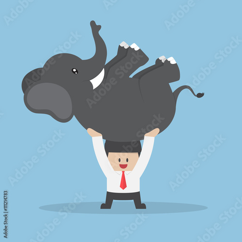 Businessman lifting an elephant