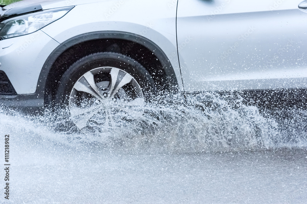 Fototapeta premium car rain puddle splashing water