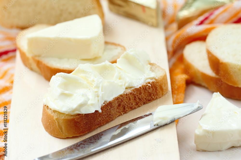Slice of bread with cream cheese and butter for breakfast