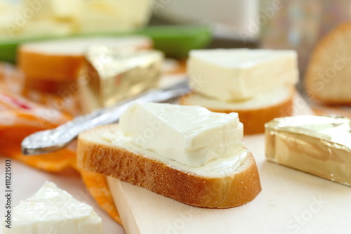 Slice of bread with cream cheese and butter for breakfast
