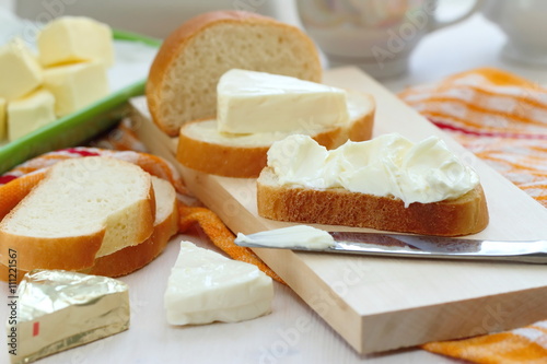 Slice of bread with cream cheese and butter for breakfast