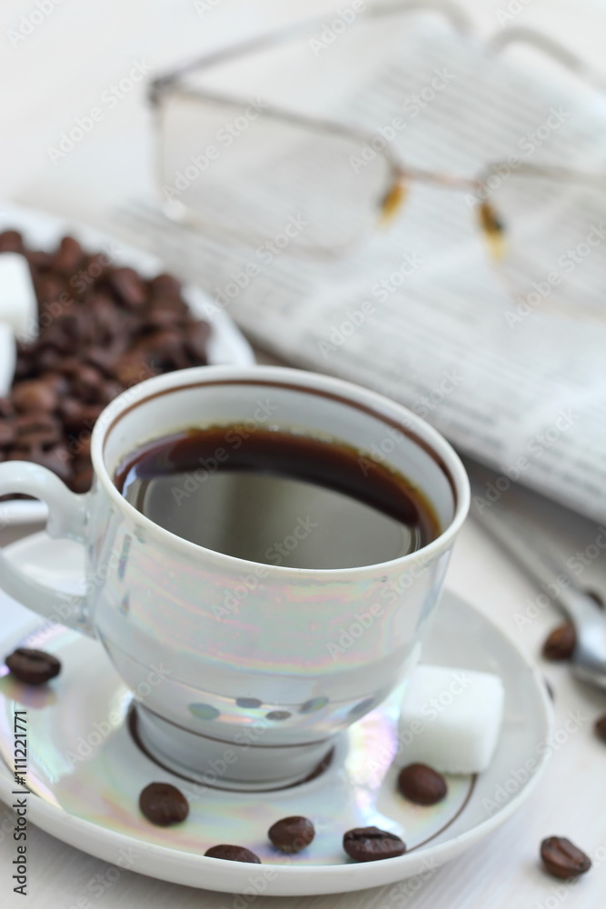 Cup of black coffee and newspapper Cup of black coffee and newspapper
