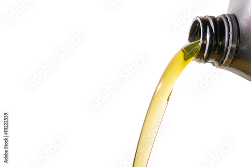 Pouring motor oil on white background