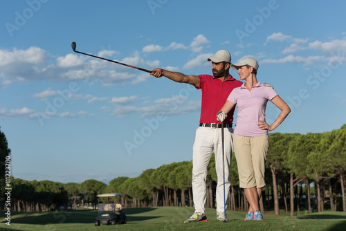portrait of couple on golf course