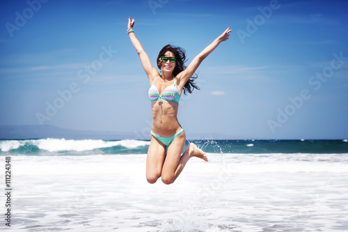 Happy woman on a beach © Anna Om