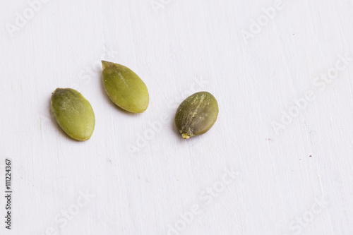 pumpkin seeds on white table