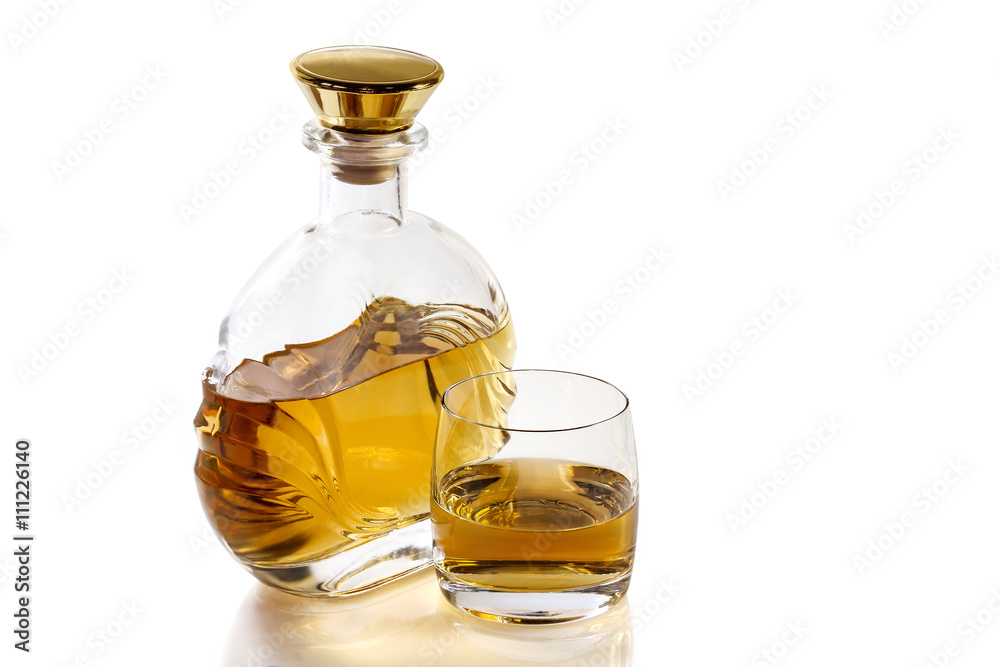 Bottle and glass of whiskey on white background Bottle and glass of whiskey on white background