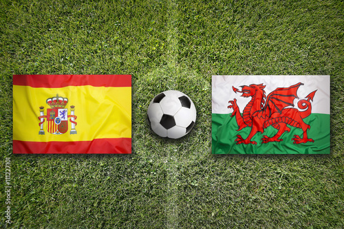 Spain vs. Wales flags on soccer field