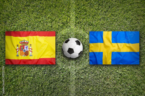 Spain vs. Sweden flags on soccer field
