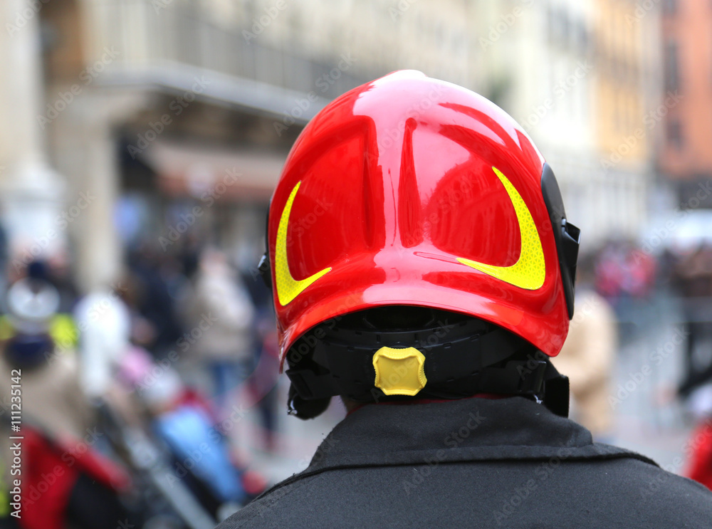 fireman with red hard hat in the city fireman with red hard hat in the city