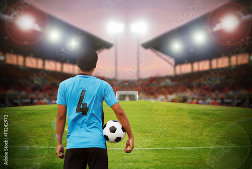 football player and soccer player holding ball on football stadi © tuiphotoengineer