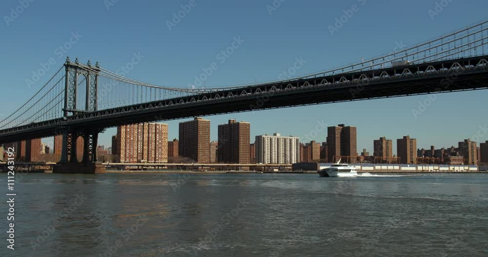 Boat passing beneath the Iconic Manhattan Bridge. Boat passing beneath the Iconic Manhattan Bridge.