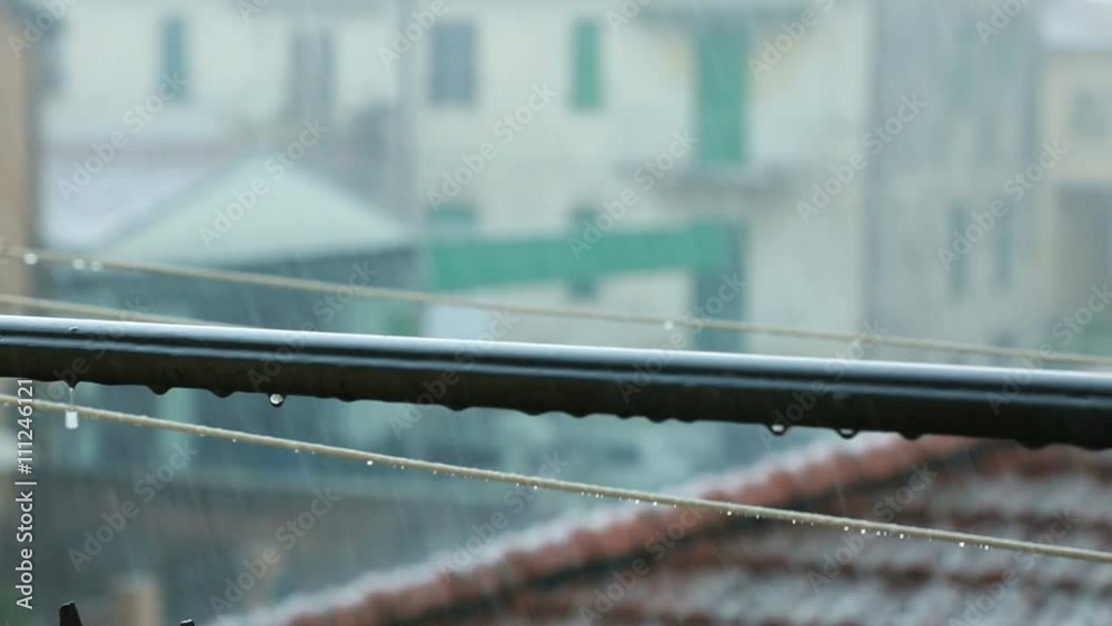Hailstorm is Crashing onto the Roof of an House in a City. Hailstorm is Crashing onto the Roof of an House in a City.