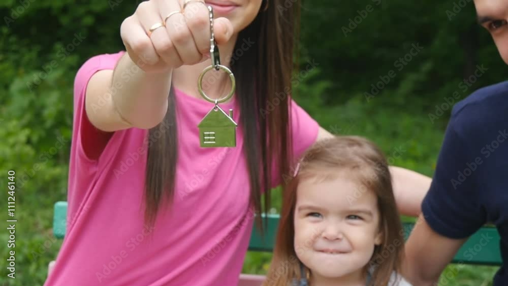 Happy family with the keys to the apartment Happy family with the keys to the apartment
