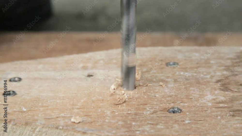 Drill Bit is drilling the Wood. Drill Bit is drilling the Wood.