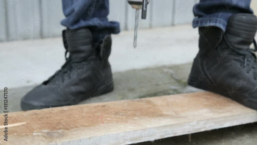 Worker Man Carpenter is Drilling the Wood. Worker Man Carpenter is Drilling the Wood.