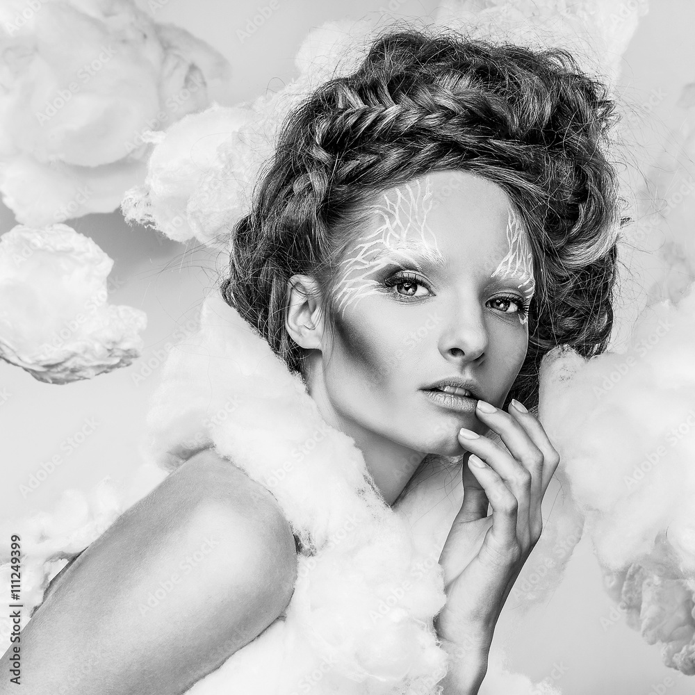 Obraz premium Romantic beauty with magnificent hair wandering in clouds. Fine art black-white studio fashion portrait.