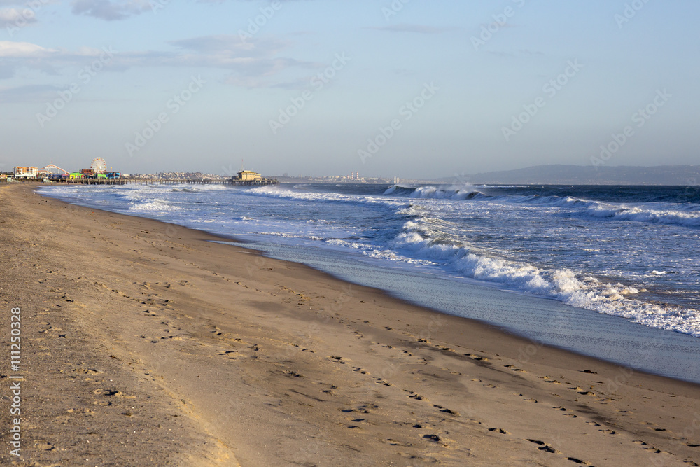 Amusement Park on the Pacific ocean, the beach landscape. The ocean, beach and blue sky in USA, Santa Monica. 