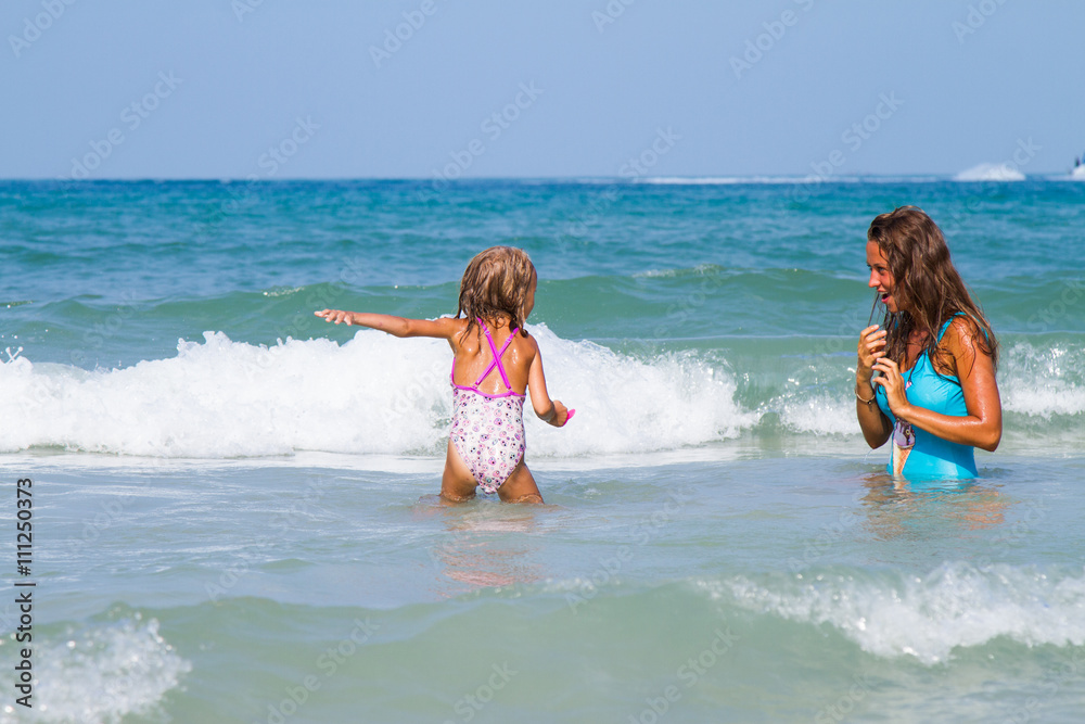 Mum with daughter on the beach Mum with daughter on the beach