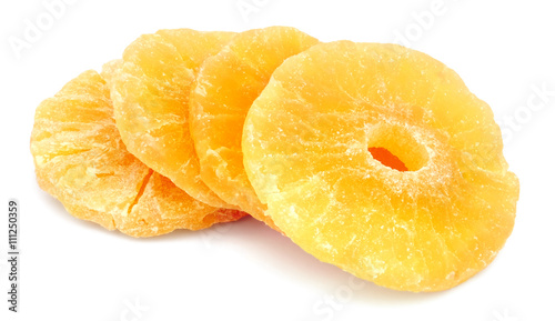 Dried candied pineapple rings isolated on white background.