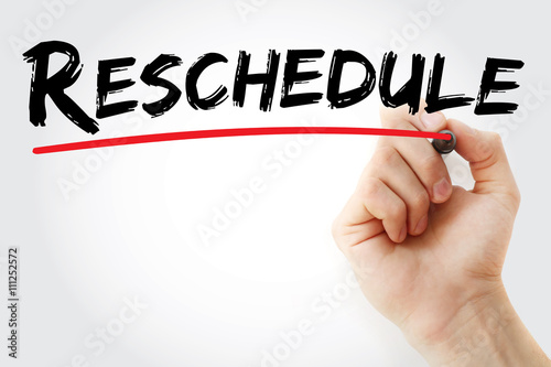 Hand writing Reschedule with marker, business concept background photo