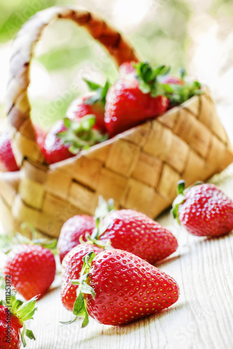 Fresh strawberries on a natural green blurred background  select