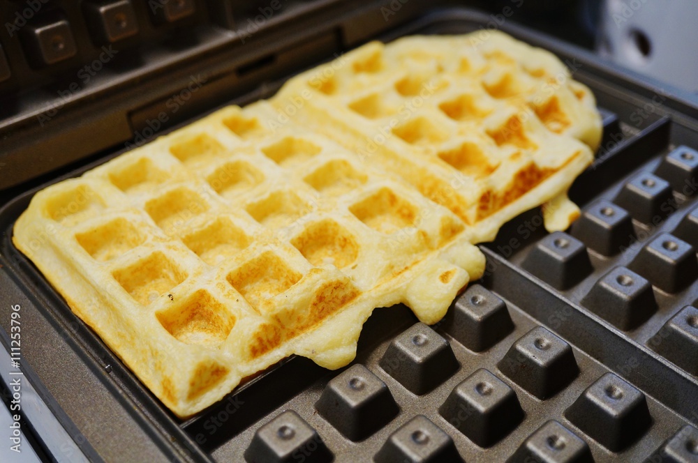 Making waffles on the waffle iron Making waffles on the waffle iron