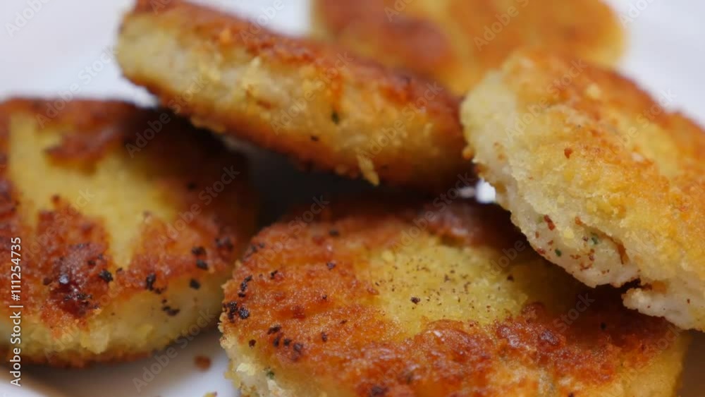 Unhealthy burgers of fish and bread crumbs fried in vegetable oil close-up food background 4K 2160p 30fps UltraHD tilting video - Fried on oil fish bars on plate served tilt 4K 3840X2160 UHD footage Unhealthy burgers of fish and bread crumbs fried in vegetable oil close-up food background 4K 2160p 30fps UltraHD tilting video - Fried on oil fish bars on plate served tilt 4K 3840X2160 UHD footage