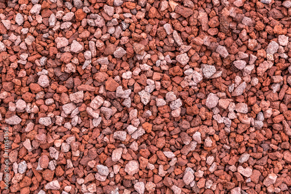closeup of crushed red lava rock. closeup of crushed red lava rock.