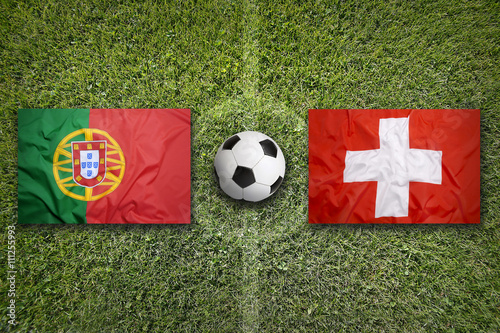 Portugal vs. Switzerland flags on soccer field