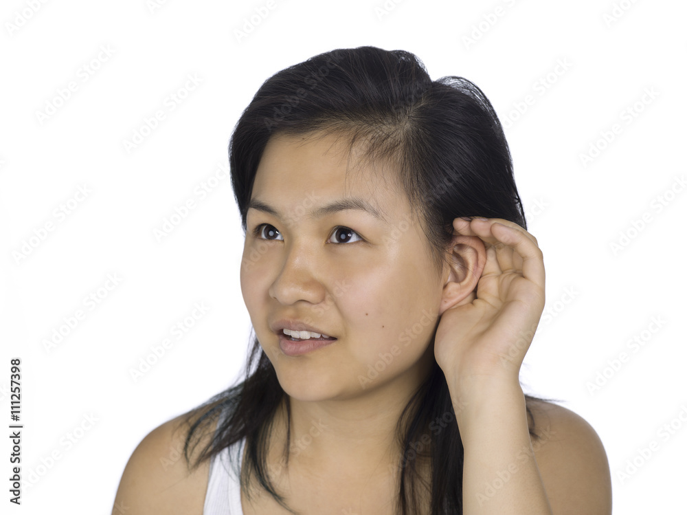 young woman cupping hand to ear, trying to listen something. young woman cupping hand to ear, trying to listen something.