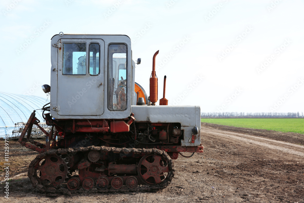 Grey tractor at farm Grey tractor at farm