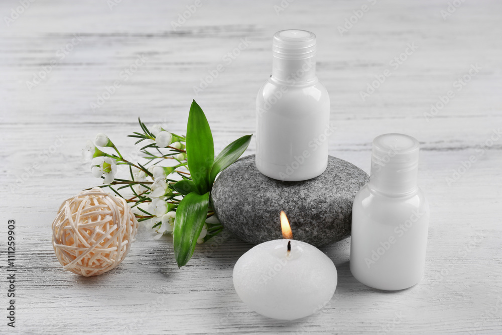 Composition of spa treatment on white wooden background