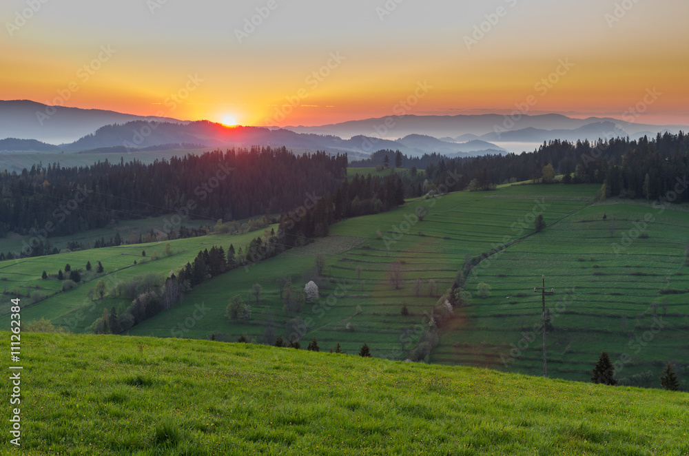 Fototapeta premium Moments after sunrise in misty Carpathian mountains, spring, Poland