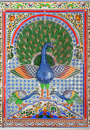 UDAIPUR, INDIA - JANUARY 30, 2014: Beautiful glass mosaics of peacocks at Udaipur City Palace, constructed by Sajjan Singh, in Rajasthan, India.