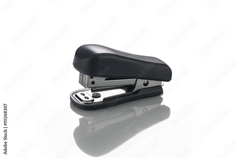 Stapler paper isolated with reflection on a white background Stapler paper isolated with reflection on a white background