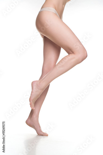 woman legs isolated on white. Depilation or another healths concept