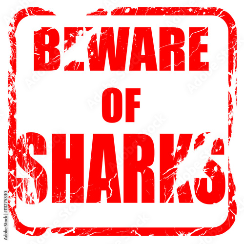Beware of sharks sign  red rubber stamp with grunge edges