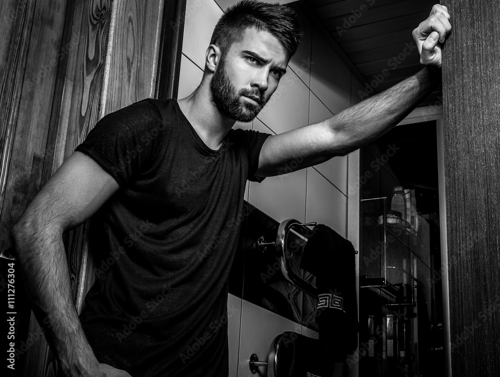 Obraz premium Handsome men indoor. Black-white portrait.