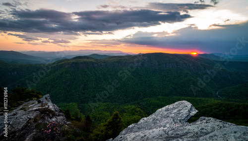 Fototapeta Naklejka Na Ścianę i Meble -  The colorful sunset from the top of Hawksbill Mountain during the spring bloom of the Rhododendrons 