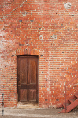 Timber door in red brick building