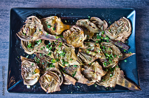 artichokes baked with oil, parsley and lemon photo