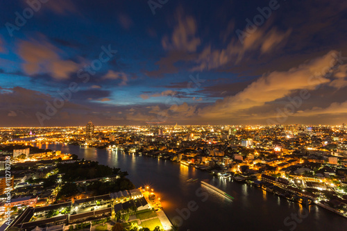 building in city with Chaophaya river at Bangkok, Thailand photo