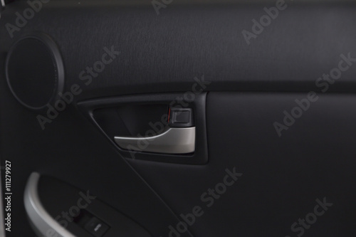 door handle inside of new car © 88studio