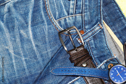 Blue jean denim and leather wallet in pocket