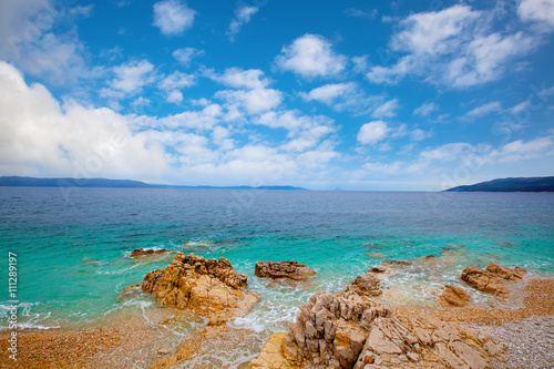 Fototapeta Naklejka Na Ścianę i Meble -  Small Adriatic coastline Croatia. Clear azure water under blue s