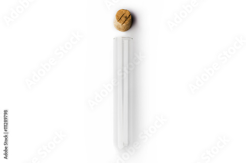 Glass transparent test tube with cork above on white background