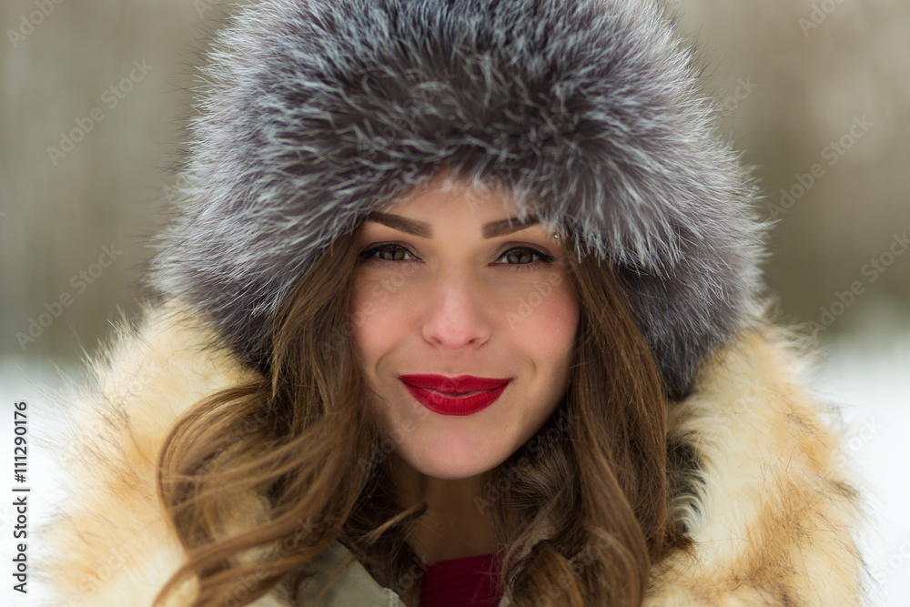 Beautiful woman in winter coat and fur hat Beautiful woman in winter coat and fur hat